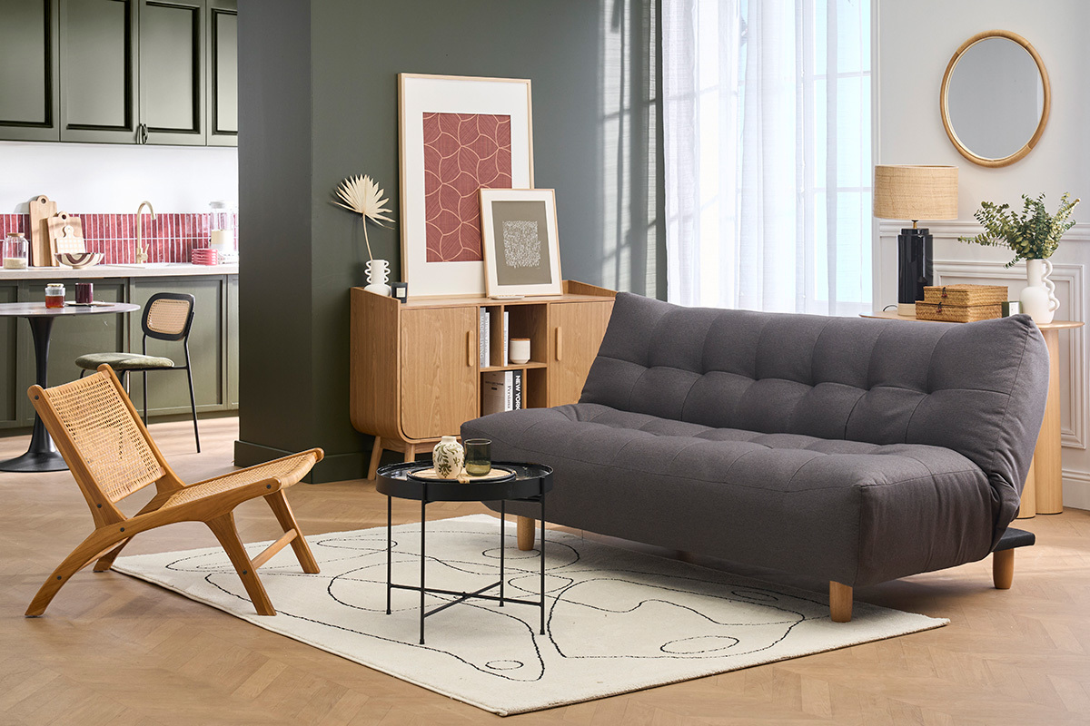 Canap� convertible 3 places gris fonc� et bois clair YUMI, vue de profil dans un salon moderne.
