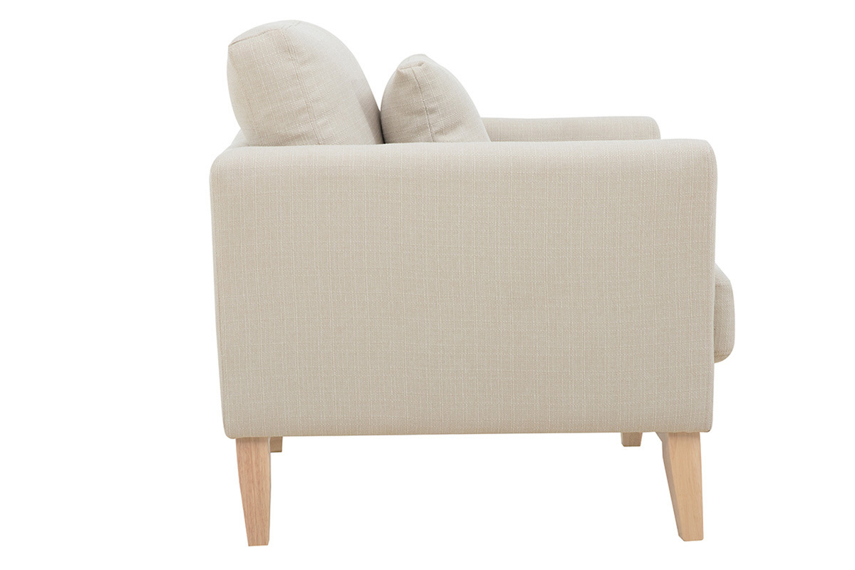 Vue de profil du fauteuil scandinave d�houssable beige avec coussins et pieds en bois clair.